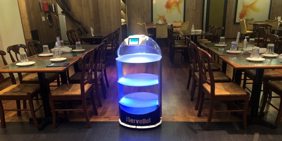 iServeBot autonomous service robot delivering to tables in a restaurant